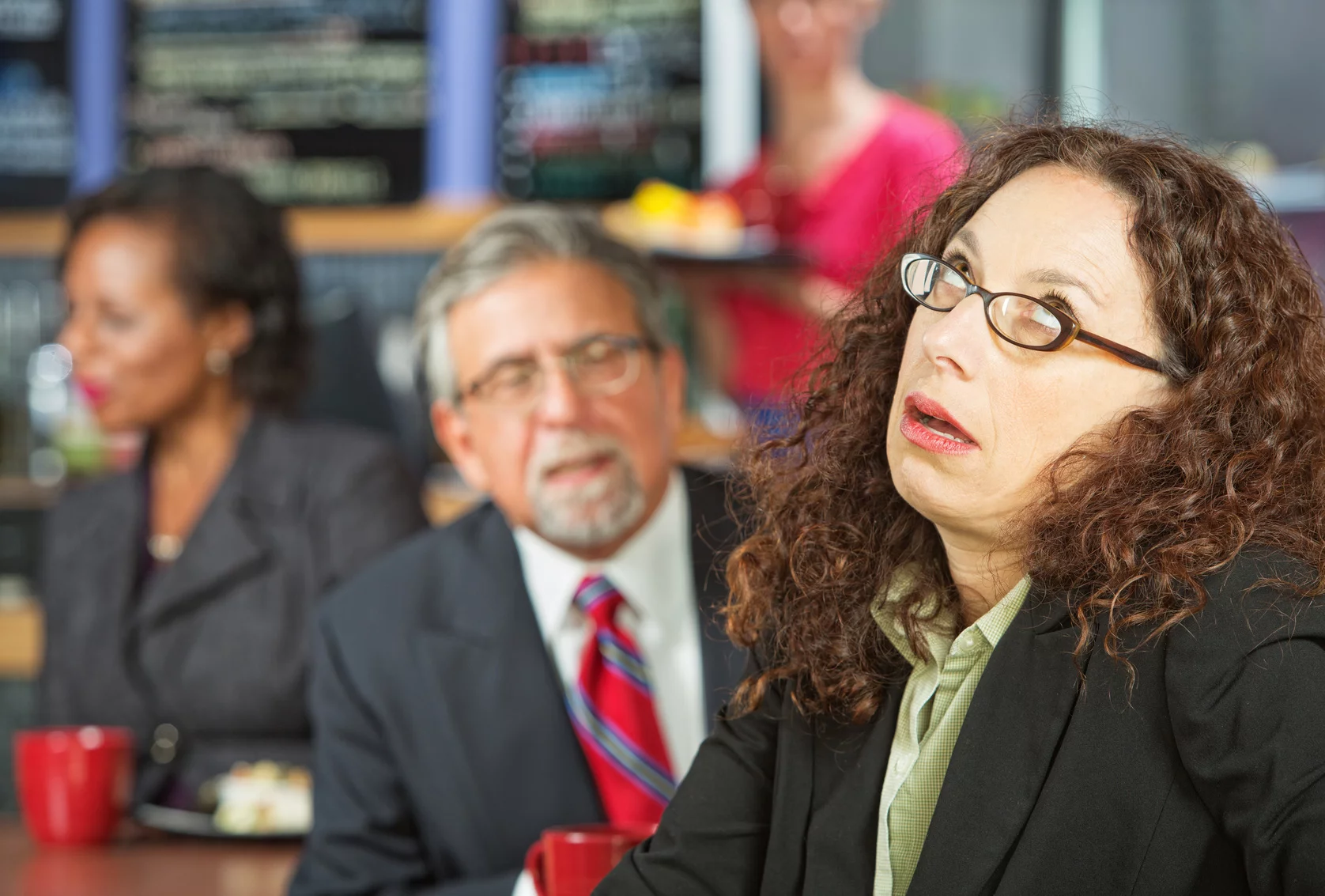 coworkers argue and roll their eyes