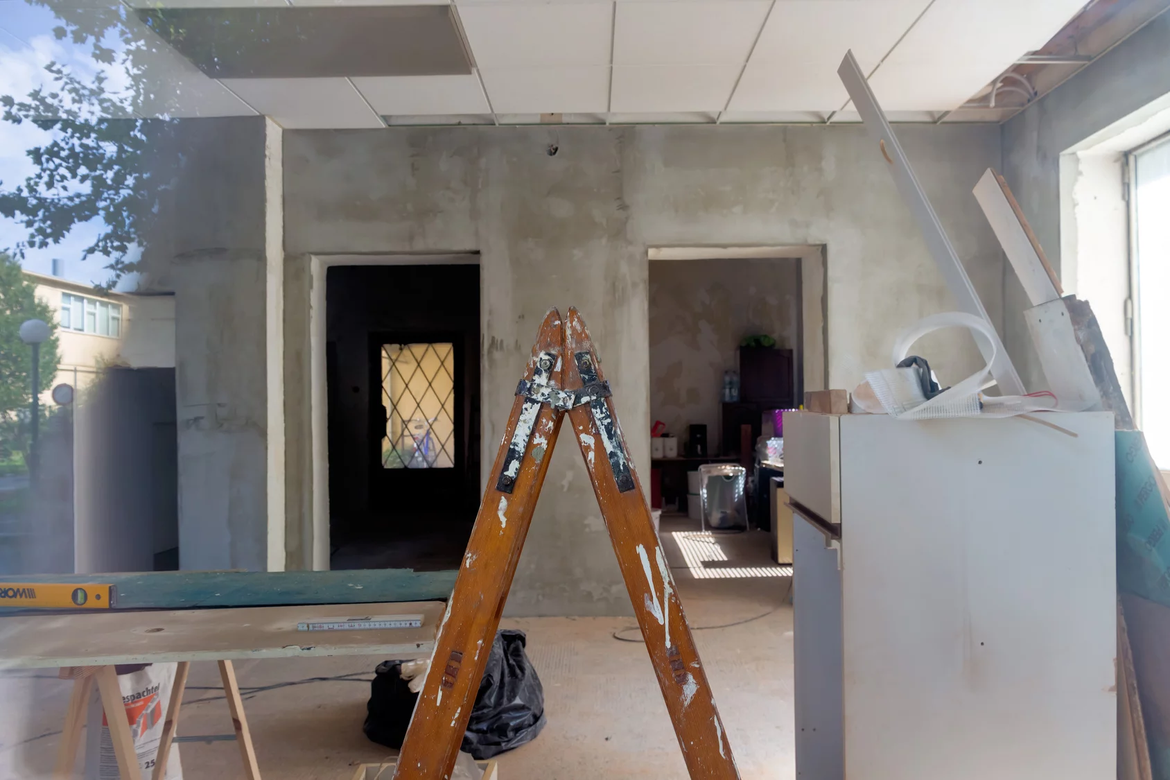 interior office space under construction with ladder