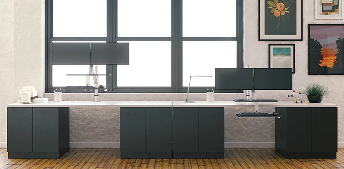 Sit-To-Stand Desk with 2 workstations against windows