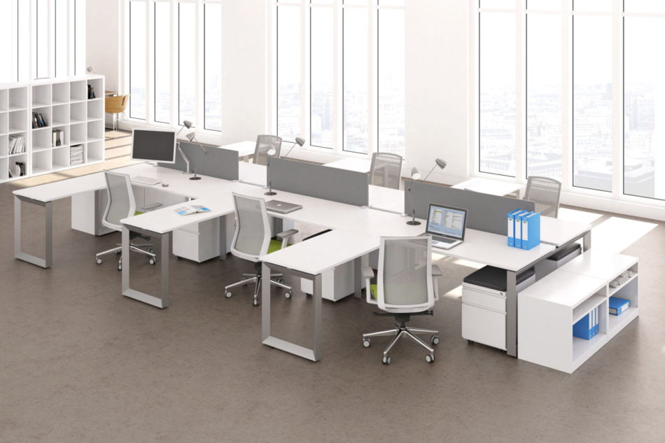 Studio photography of AMQ's Icon Benching. There is two 6-Pack single run workspaces, each with a green cushioned chair placed at the desk. It is using the white laminate. Another part of the desk juts out. The sun is shining in from the window beyond.