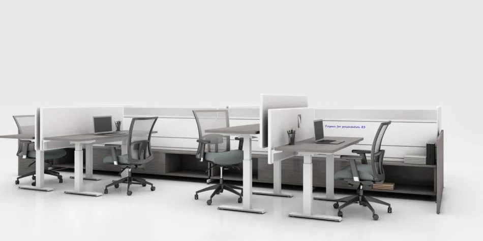 Global's 8-person power beam desks in a white studio setting. Each workstation has a laptop open. To the user's right are credenzas with Acoujou paneling