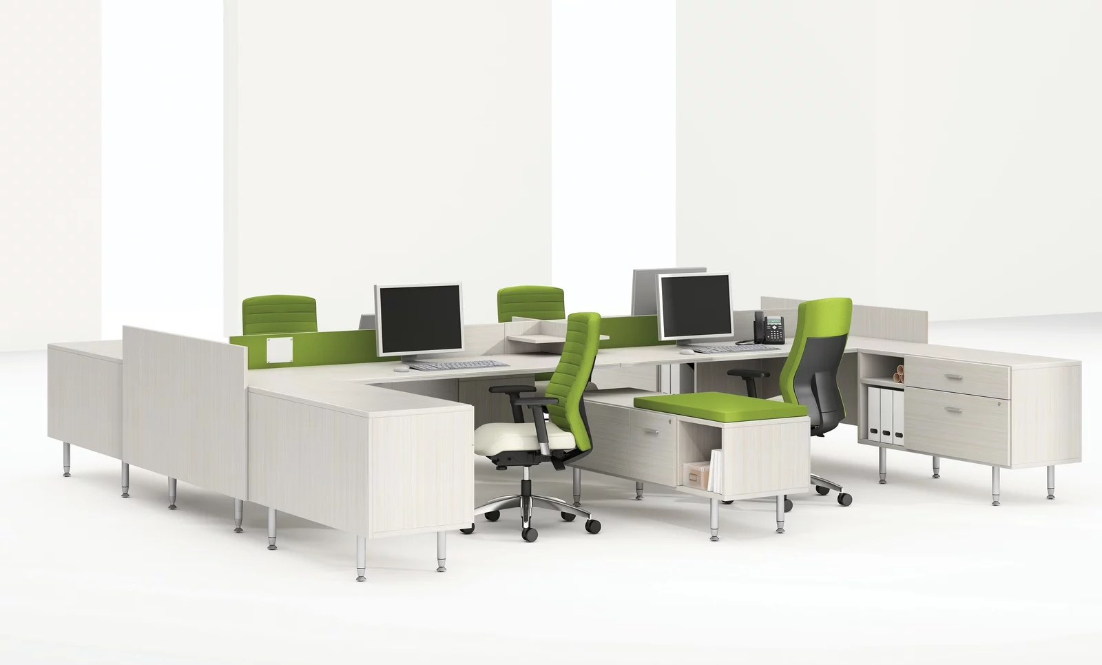 Global's 4-person sidebar benching in a stark white studio set. Each workstation has a flat screen monitor and a green backed rolling chair. The desktop and returns on the side are finished in a white finish.