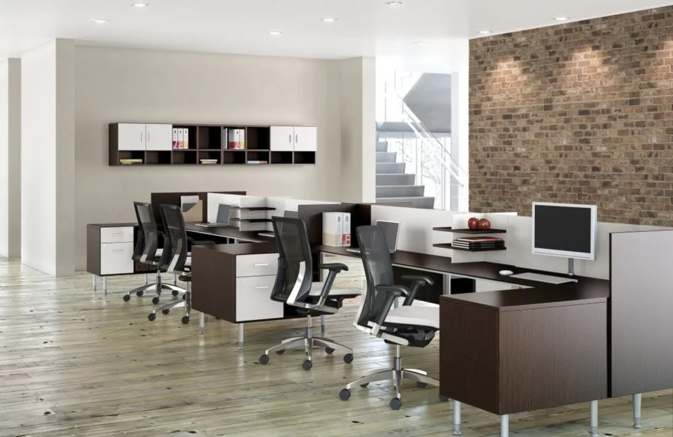 Studio photography of Global's 6-person sidebar benching has a dark walnut finish. A wall with a brick facade is just behind it, and an open ingress leads to a space with stairs leading up.