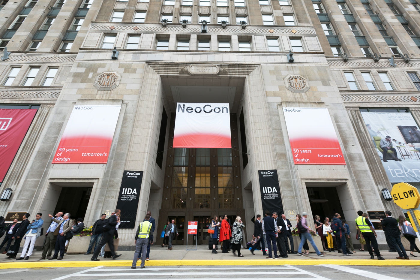 commercial interiors show neocon flies their banner outside merchandise mart in chicago