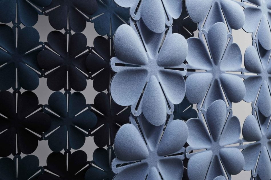 Studio shot of Airbloom acoustic panels forming two partitions. The set in front is in a light periwinkle, with a dark blue color contrast in the partition behind.