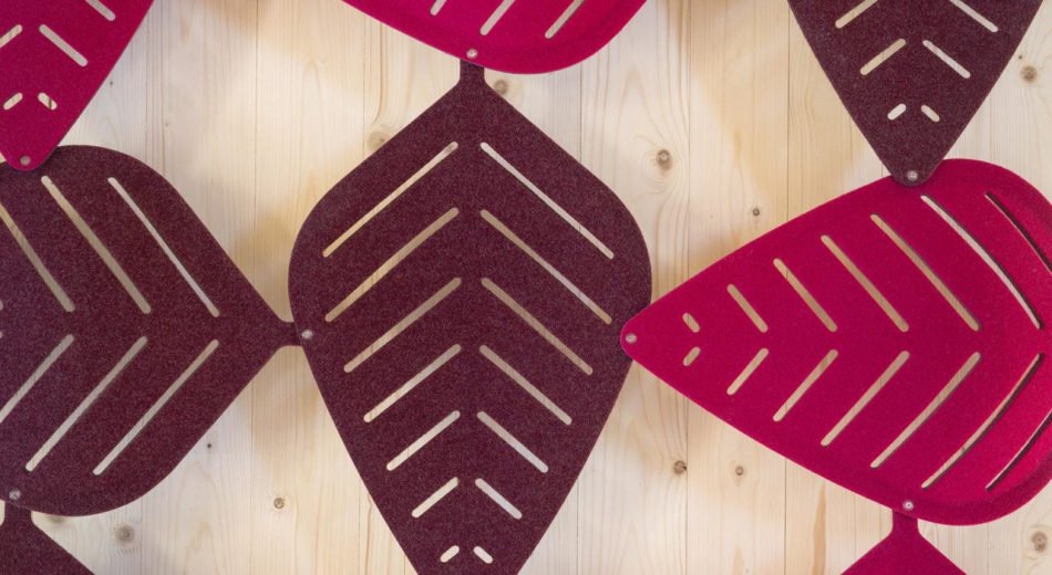 Studio shot of magenta shaded Airleaf acoustics along a wall, up close.