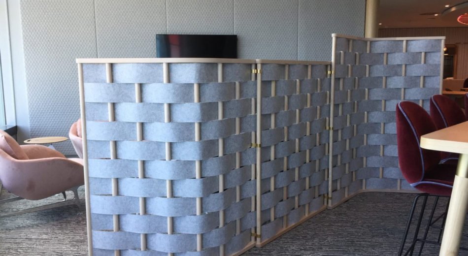 Studio shot of Bower screening seperating a seating area and conference area.