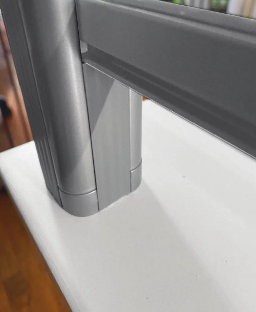 Closeup of the base of a Borders (model) screen. A slot for transactions is at the bottom.