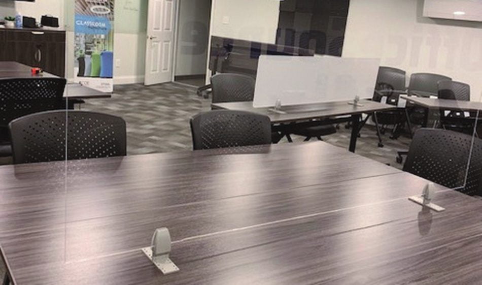Straight(model) space divider, using clear acrylic. Two chairs are placed at this table.