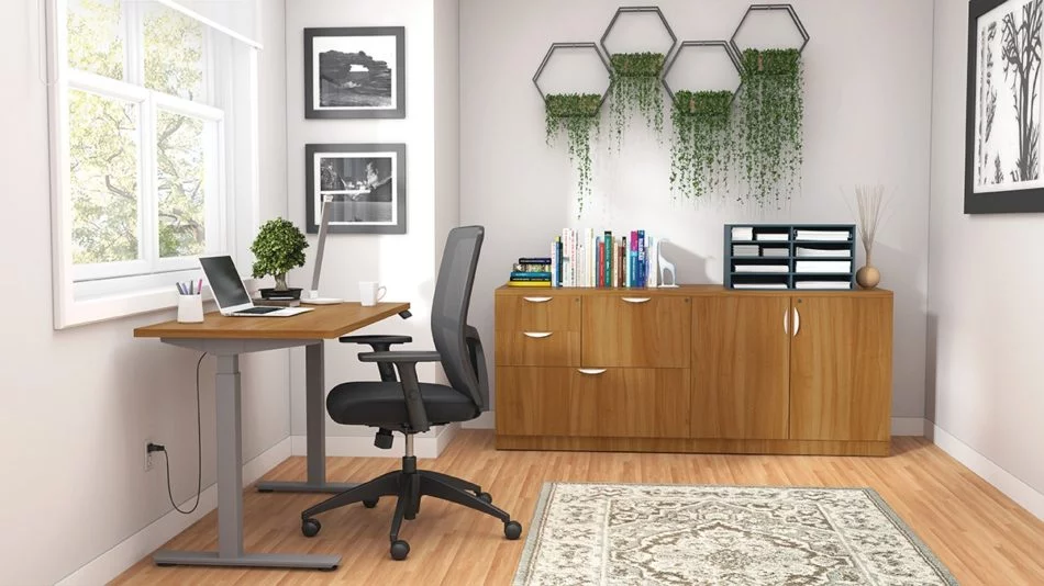 Studio shot of OTG's Home Office Setup, which has a height-adjustable work desk placed at the window. A set of four planters is hung on the wall, above the mixed storage unit. Both surfaces are finished in an Autumn Walnut. A total of four drawers and a double-door cabinet can store different supplies. On top is a set of books, with a giraffe bookend sculpture. A file box to the right holds two columns of slots for important files or as an Inbox.
