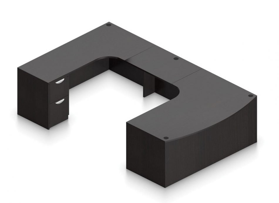 Orthographic view of an Offices to Go set of desking, using Layout B. This set consists of a 71" wide desk, with a curved bow front. A matching width credenza is arranged just across, with a 36" wide flush bridge spanning in between. At the outside of this layout is a set of pedestal drawers, with the second (top) drawer sporting a lock. This desking set is shown in an American Espresso finish.