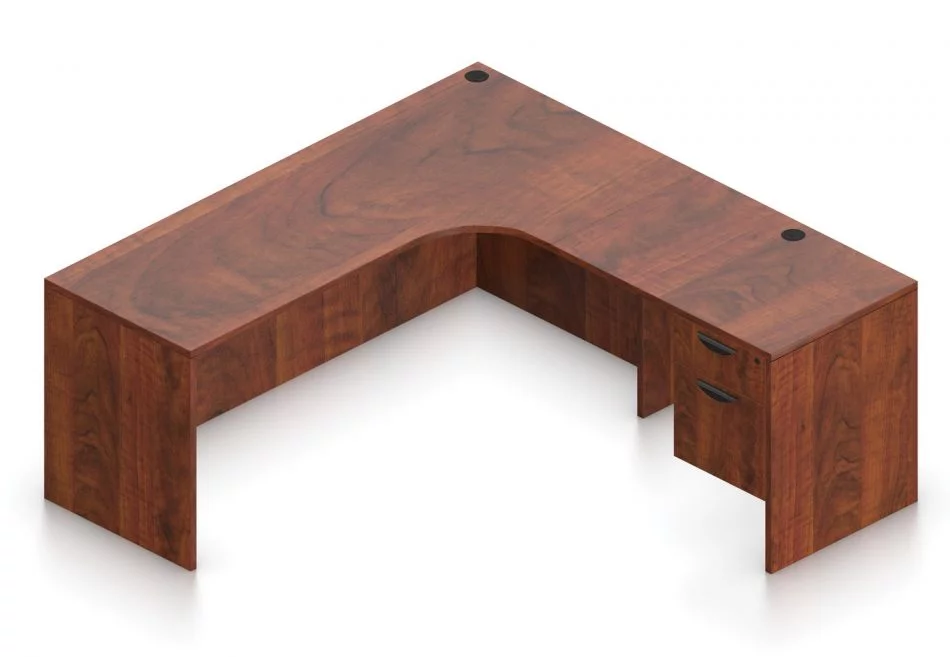Orthographic view of an Offices to Go 71" corner desk with left side extension. Its inner edge is curved, and it has a set of two hanging office drawers to the right of it, with a lock on the top. This layout is featured in an American Dark Cherry finish.