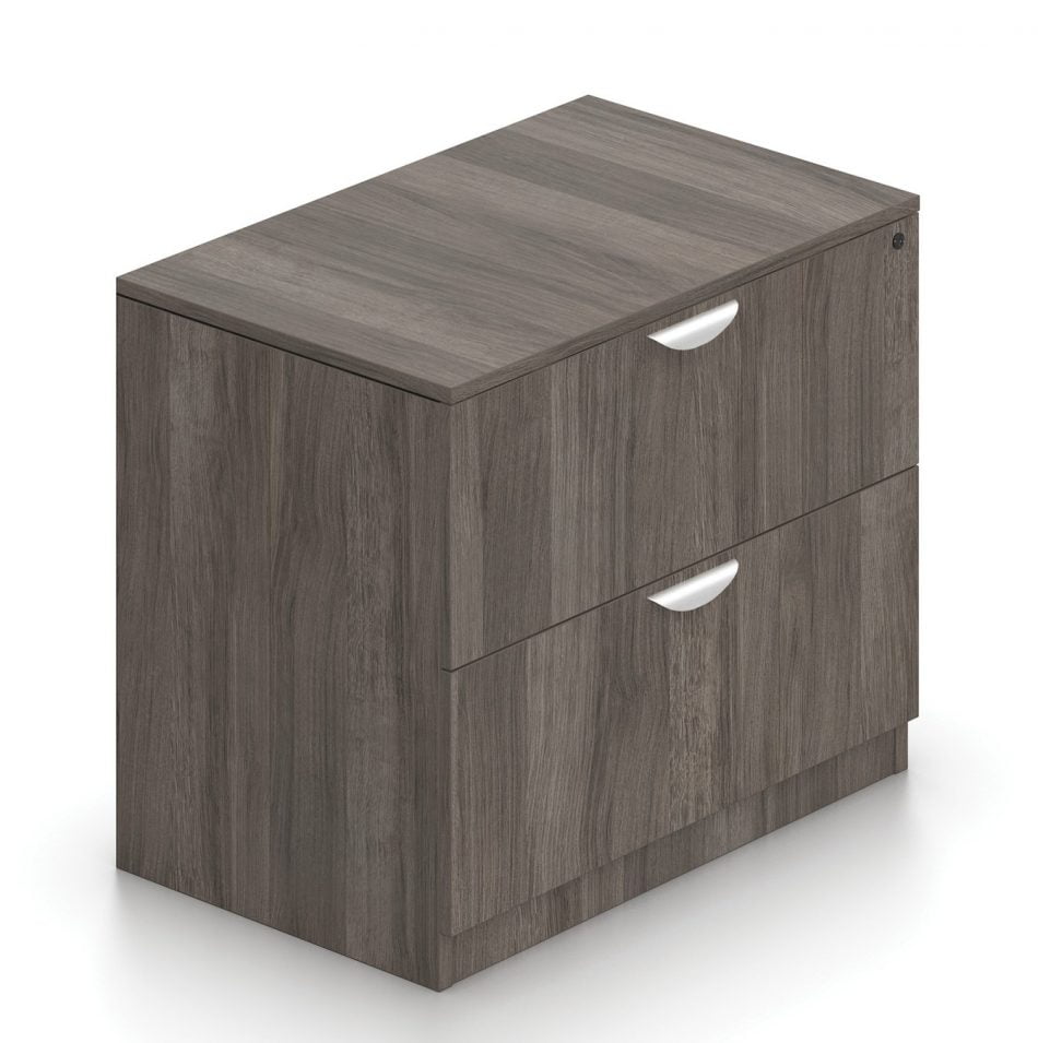Orthographic view of an Offices to Go 2-drawer storage cabinet. The top drawer features a lock. This set uses an Artisan Grey laminate finish.