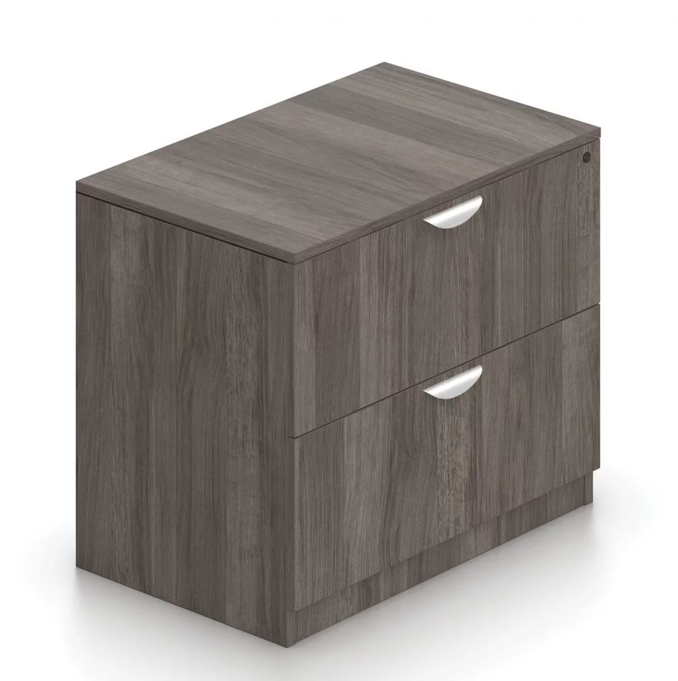 Orthographic view of an Offices to Go 2-drawer storage cabinet. The top drawer features a lock. This set uses an Artisan Grey laminate finish.