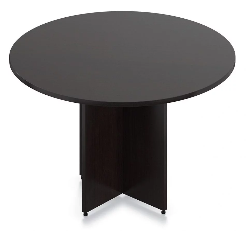 Orthographic view of an Offices to Go 48 inch round table. It is held up by a two thick wooden slats that intersect each other. The table is finished in an American Espresso laminate.