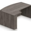 Orthographic view of an Offices to Go bow front desk. It has a short extension, curving ninety degree at your left. It has an Artisan Grey laminate finish.