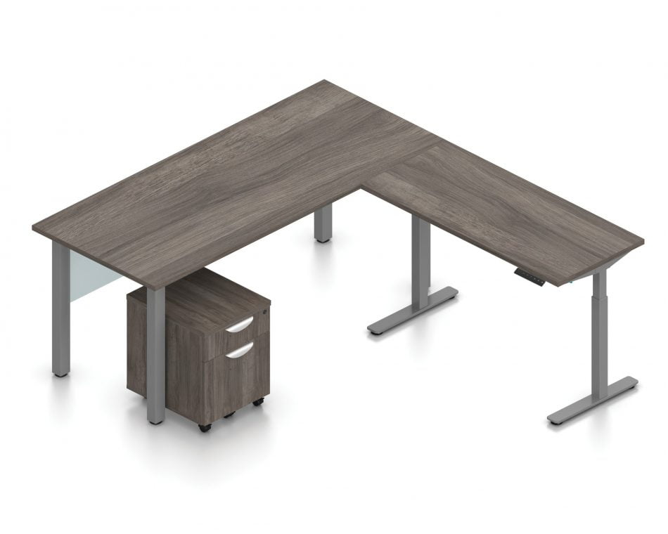 Orthographic view of an Offices to Go desk and table set, using Layout 4. This L-shaped desking consists of a 71" wide metal table with a 48" height adjustable table attached at a 90 degree angle. A rolling file pedestal is under the table, consisting of 2 drawers with a top lock. An acrylic privacy panel is mounted at the front of (underneath) the table. This layout is shown with the Artisan Grey laminate finish.