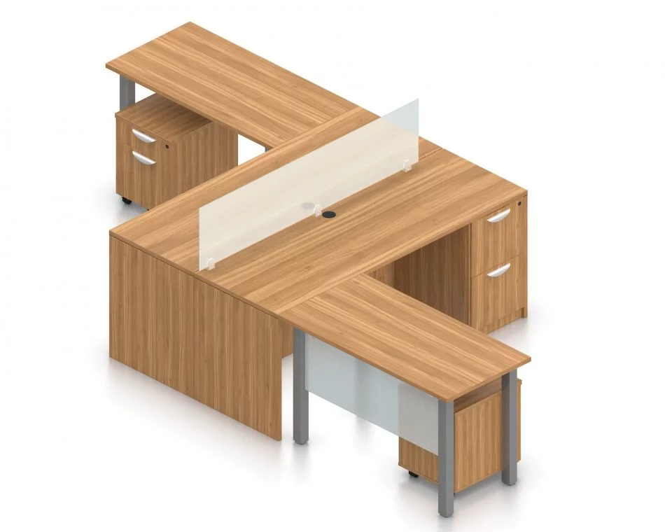 Orthographic view of an Offices to Go set of desking, using Layout 6. This set consists of two L shape workstations, adjoined at the back with an acrylic screen in-between. The 48" wide metal table extends at one side, with an acrylic privacy screen between the tungsten legs. At the right is a pair of hanging file drawers.. An additional pedestal file drawer has been rolled underneath the metal table. This layout is shown here in an Autumn Walnut finish.