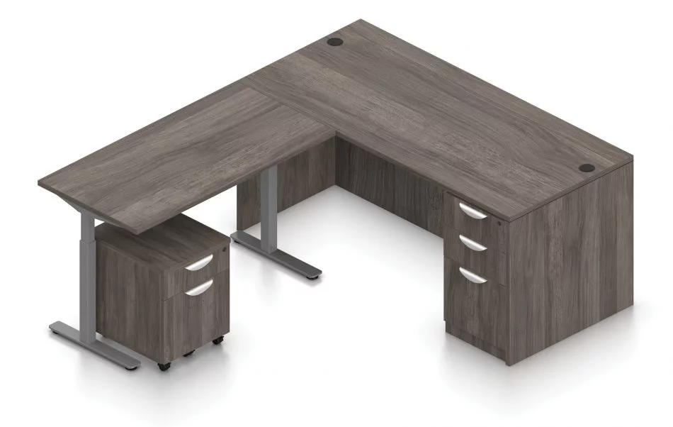 Orthographic view of an Offices to Go corner desk set, using Layout 7. A 66" wide desk and 48" table are arranged in an L-shape, the height adjustable table set level with the desk. A set of three file and drawers are set into the right side, with an additional set of pedestal drawers rolled underneath the table (at the other side). This layout is featured in an Artisan Grey finish.