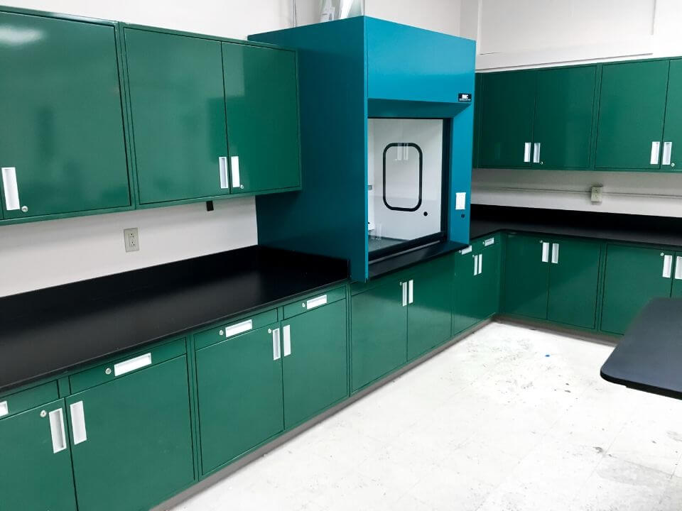 clean laboratory with green and blue finishes and fume hood