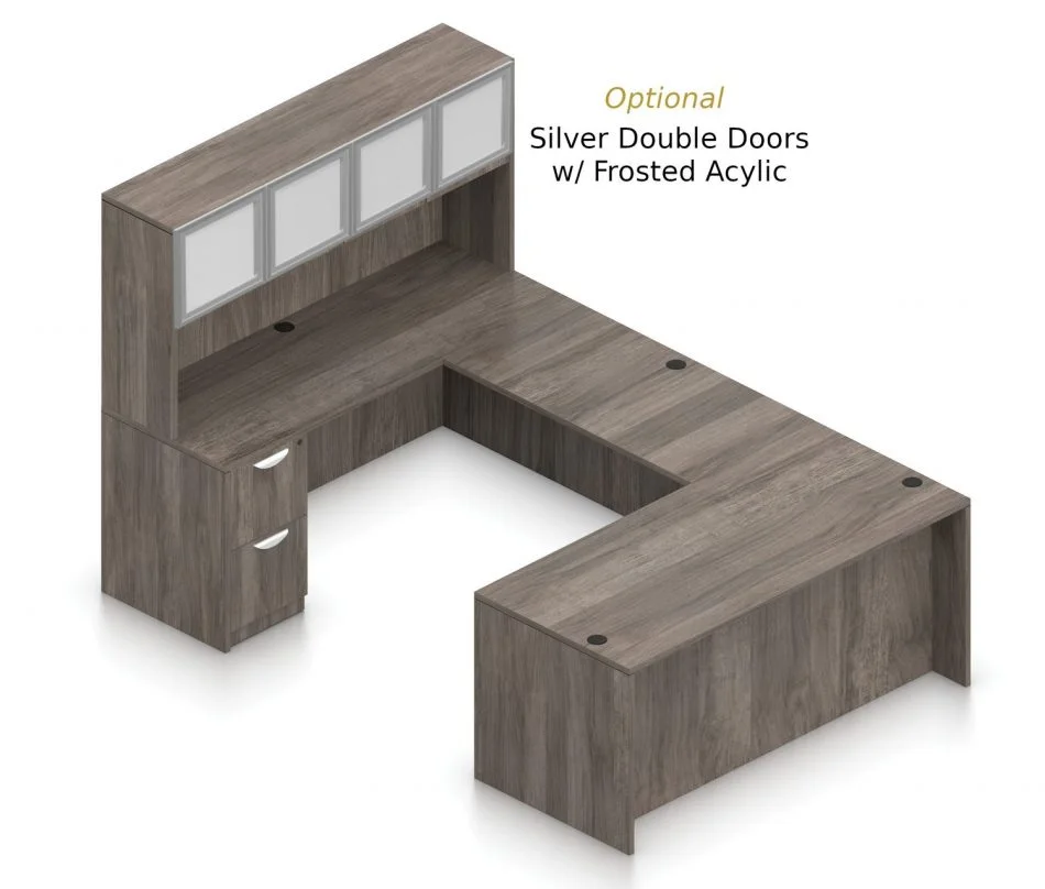 Orthographic view of an Offices to Go set of desking, using Layout B. This set consists of a 71" desk and a matching width credenza, with a 48" bridge spanning in between. A 71" Hutch rests atop the one side, and it is shown with the optional upgrade of silver double doors. There are a set of two drawers on the credenza below. Layout B is shown here in an Artisan Grey finish.