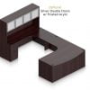 Orthographic view of an Offices to Go set of desking, using Layout D. This set consists of a two 71" desks with corner extension/attachment. A matching width hutch is stacked on top, featuring two cabinets with optional upgrade of silver double doors. In the desk, at each side, is a set of pedestal drawers. The extension side features two equal height drawers, and the other side features a set of three drawers. Each one has a lock at the top. This desking uses an American Mahogany laminate finish.