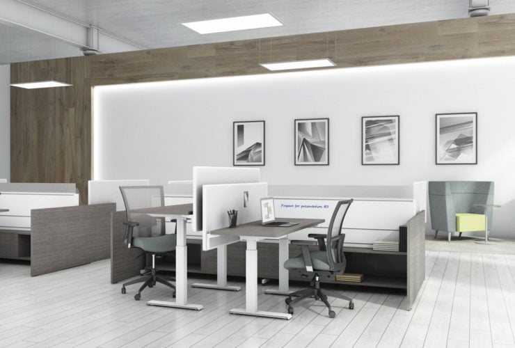 Two sets of Global's 4-person power beam desks.Each workstation has a laptop open. To the user's right are credenzas with Acoujou paneling