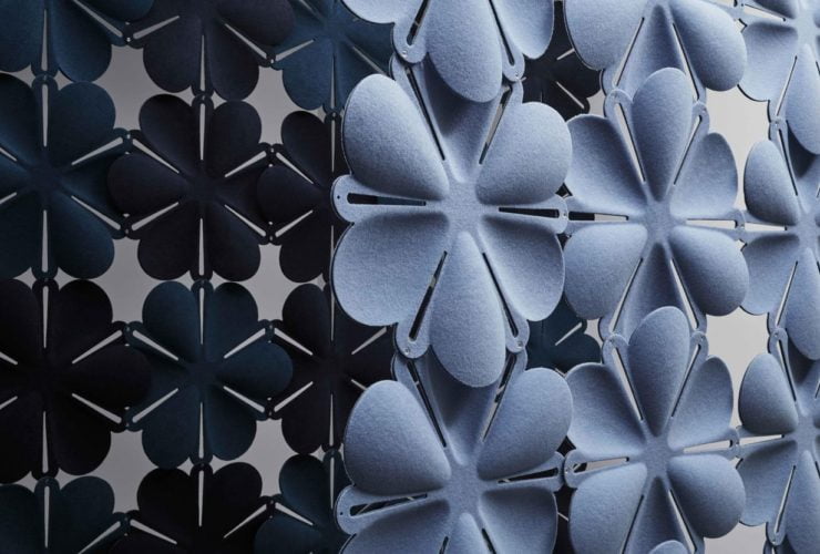 Studio shot of Airbloom acoustic panels forming two partitions. The set in front is in a light periwinkle, with a dark blue color contrast in the partition behind.