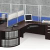 Tall Border (model) screens line the back of two L-shaped desks. Each screen uses clear acrylic, with a blue fabric panel at the bottom. Two shorter screens divide the desks on the side, with the top panels using frosted acrylic. Each desk has a computer monitor, with a phone at the side.