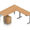 Orthographic view of an Offices to Go desk and table set, using Layout 4. This L-shaped desking consists of a 71" wide metal table with a 48" height adjustable table attached at a 90 degree angle. A rolling file pedestal is under the table, consisting of 2 drawers with a top lock. An acrylic privacy panel is mounted at the front of (underneath) the table. This layout is shown with the Autumn Walnut laminate finish.