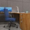 Studio photography of Offices to Go's laminate, L shaped workstation from the side. A blue high backed cushioned chair is placed at the desk, with two monitors in front.