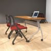 Studio photography of Offices to Go's laminate flip top training tables. The table has tungsten finished metal legs, and an Autumn Walnut laminate tabletop. Two black framed nesting chairs are placed at the table, each with a plush red cushion. A ​laptop rests on top of the table, open.