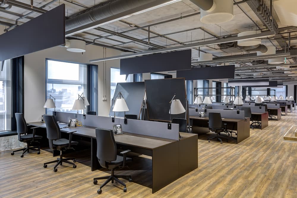 Wide view of office furniture, desks, and cubicles
